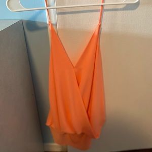 Thin strap blouse. Tangerine color. Low cut back